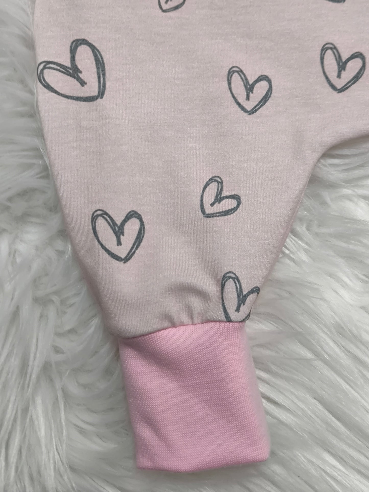Strampler rosa herzen